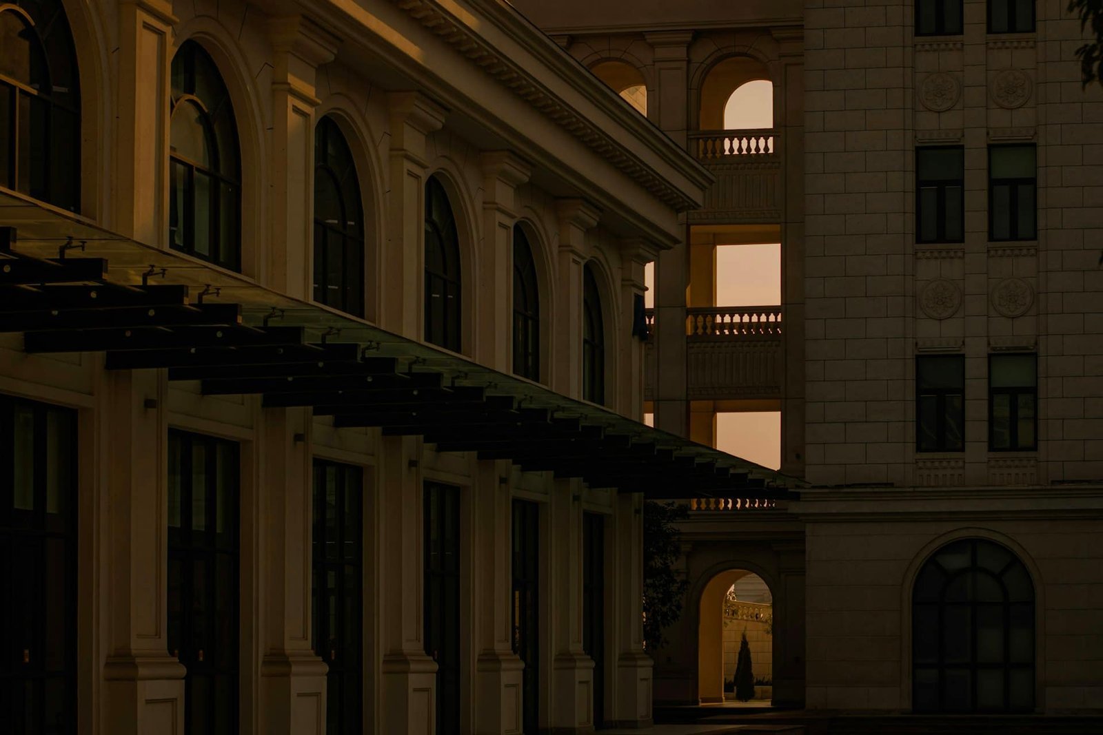 A stone building facade in warm light